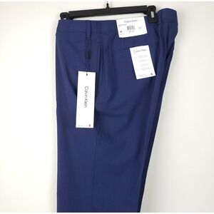 green emerald velvet dress Calvin Klein Men's Slim Fit Tech Solid Performance Dress Pants (Black,  42Wx30L) at Amazon Men's Clothing store main image 0